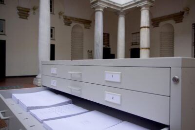 Gray Cupboard cabinet with written papers inside