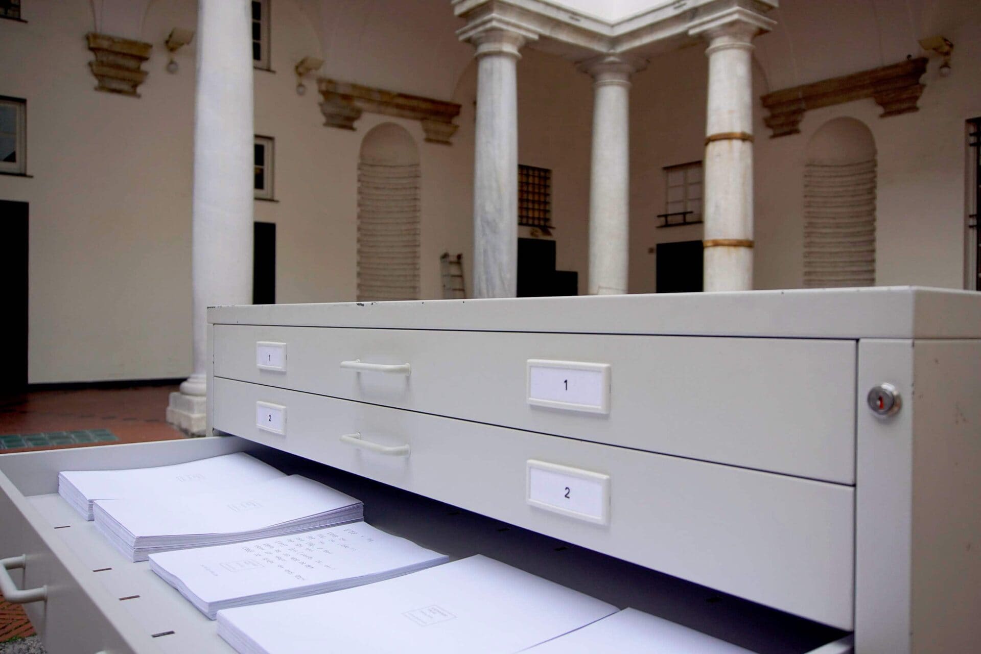 Gray Cupboard cabinet with written papers inside