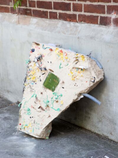 Concrete and plastic remnants sculpture called Hard Core, Soft Edges, by artists Patricia Sandonis and Jelena Fuzinato shown in Bärenzwinger in Berlin