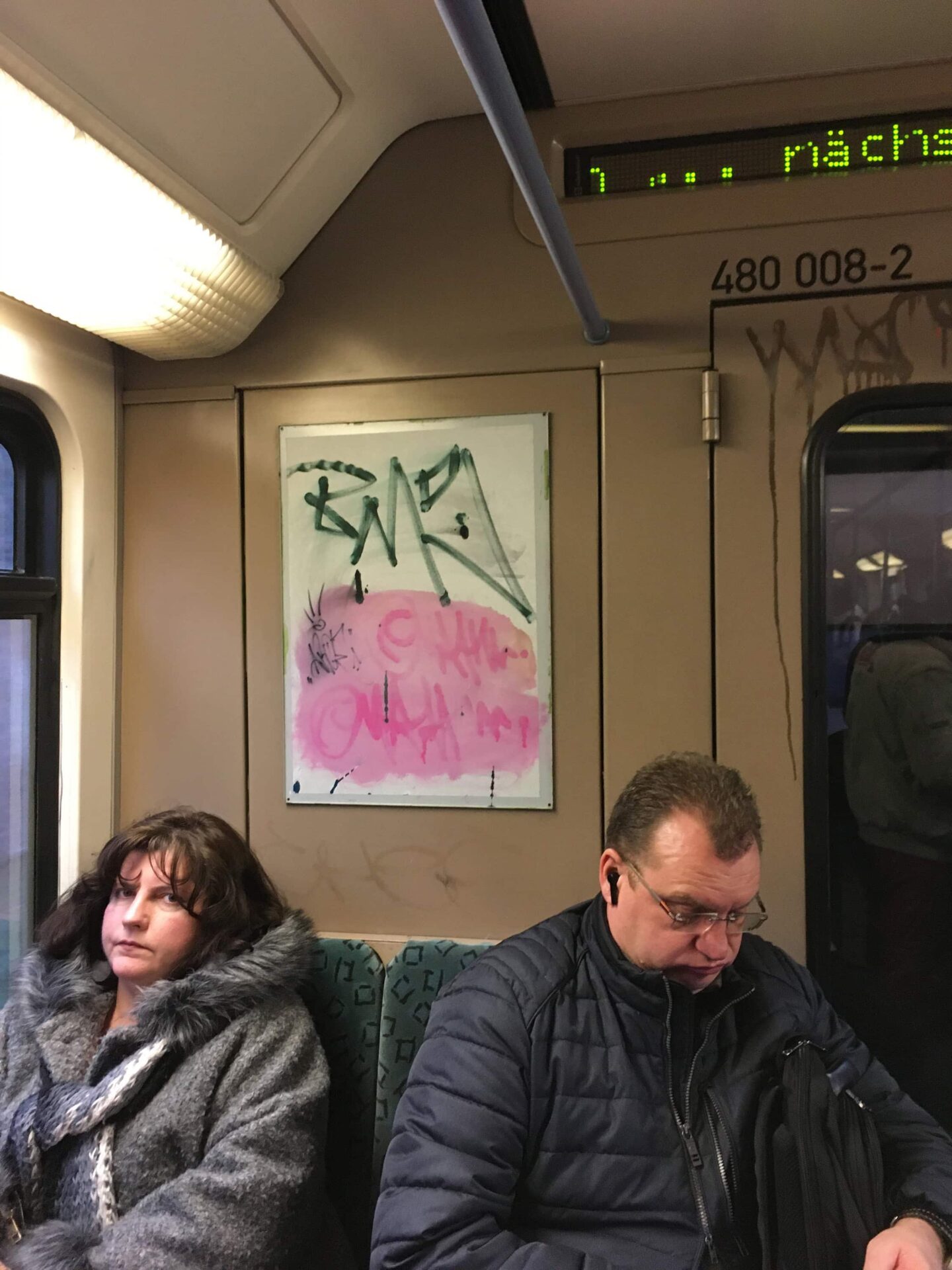 Photography by artist Patricia Sandonis of two people sitting in a wagon of the S-Bahn in Berlin