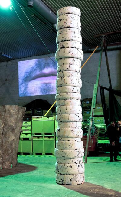 Patricia Sandonis art installation titled Photo Until it Becomes Marble, showing a big-format white column made out of car tires