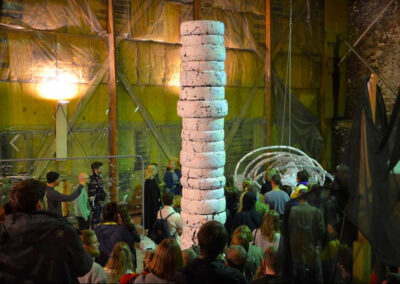 Opening of the art exhibition called Monumental Temporal at Praksis, Oslo. White column of car tires in the middle, by artist Patricia Sandonis