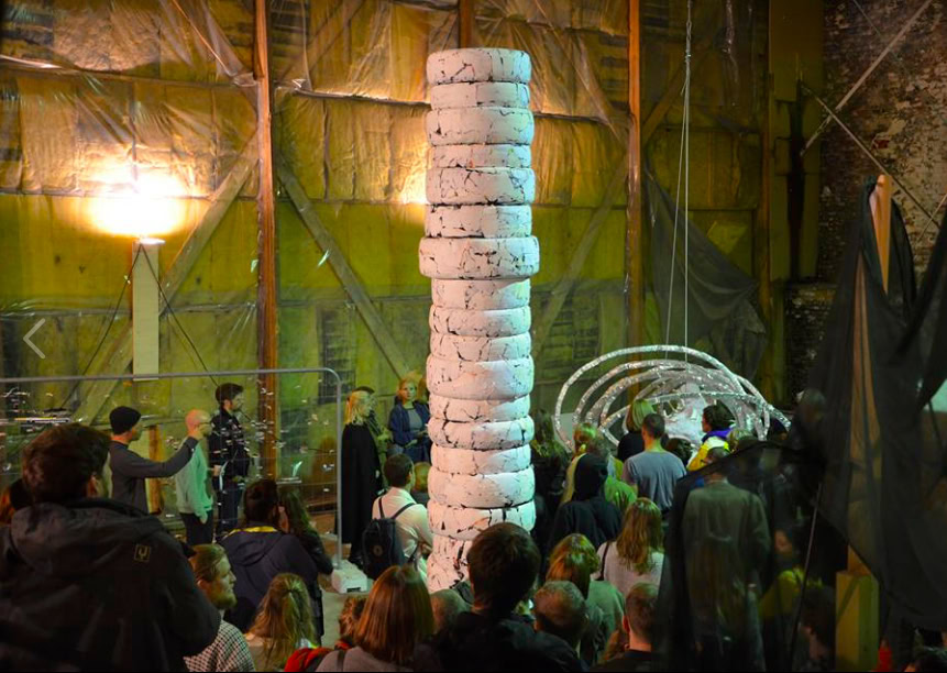 Opening of the art exhibition called Monumental Temporal at Praksis, Oslo. White column of car tires in the middle, by artist Patricia Sandonis