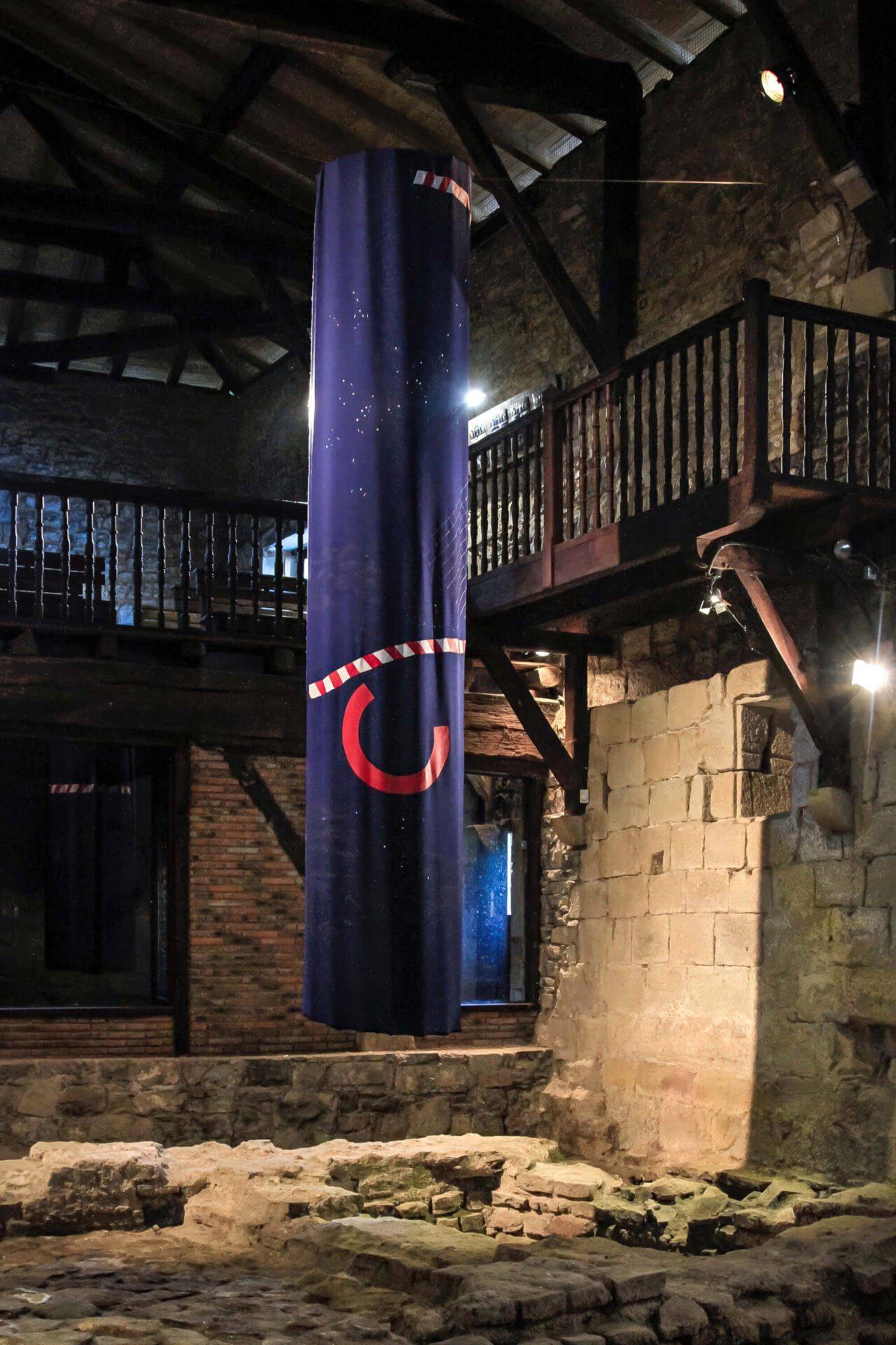Patricia Sandonis art installation at Museo Oiasso called The Memory Avant Garde, showing a hanging big dark blue column