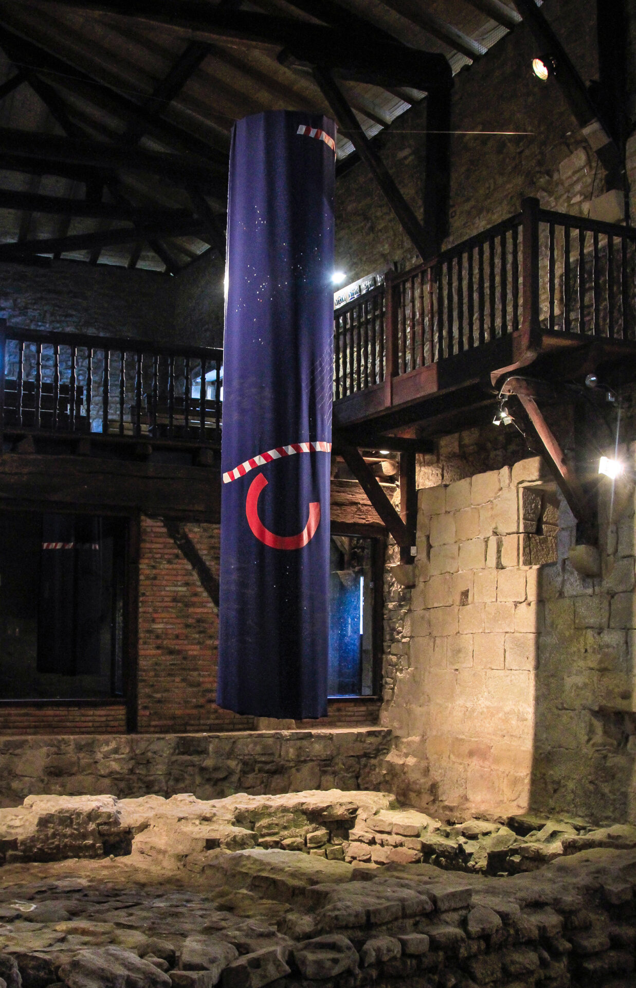 Patricia Sandonis art installation at Museo Oiasso called The Memory Avant Garde, showing a hanging big dark blue column