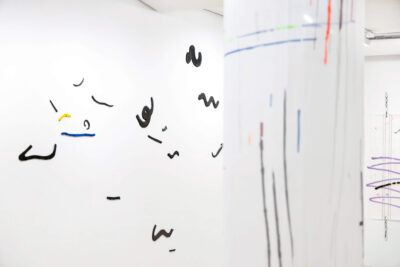 Art installation with handmade glazed ceramics on an exhibition wall by the artist Patricia Sandonis