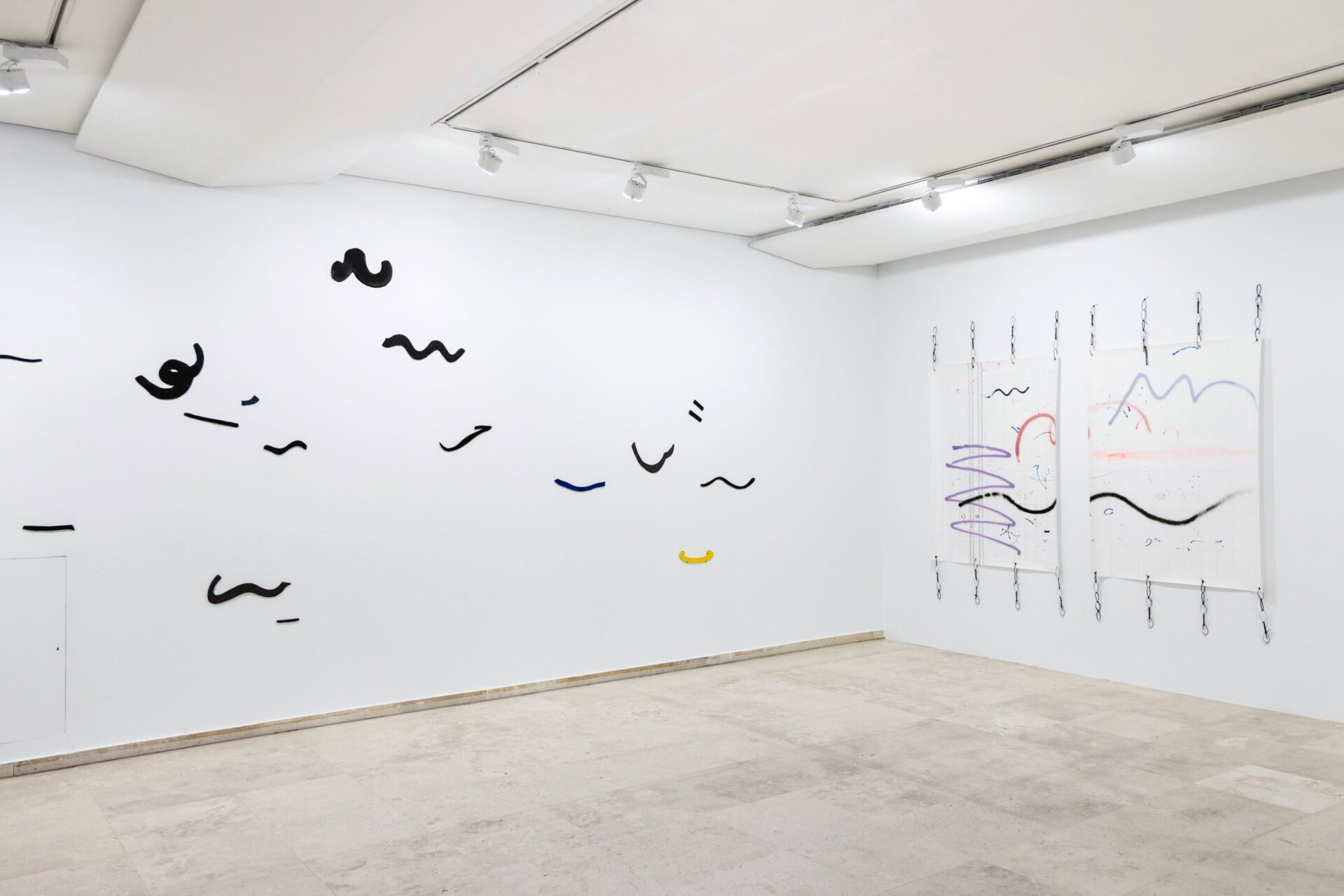Contemporary art exhibition by artist Patricia Sandonis at Museo Patio Herreriano, showing ceramic forms on a wall and two drawings on paper