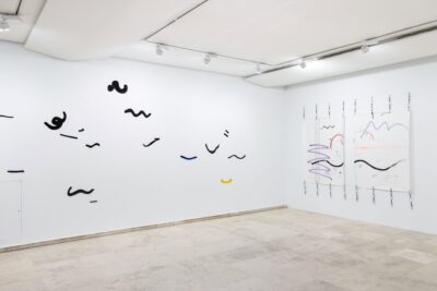 Contemporary art exhibition by artist Patricia Sandonis at Museo Patio Herreriano, showing ceramic forms on a wall and two drawings on paper