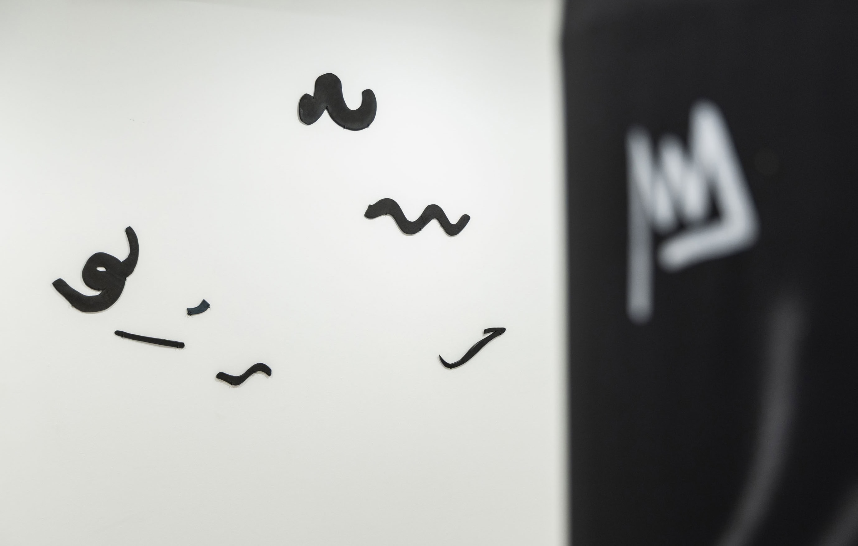 Black and white forms from the art installation Very Important, made by contemporary artist Patricia Sandonis for Museo Patio Herreriano