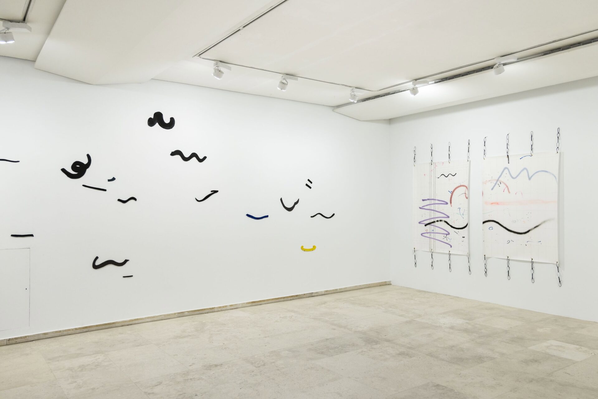 Contemporary art exhibition by artist Patricia Sandonis at Museo Patio Herreriano, showing ceramic forms on a wall and two drawings on paper