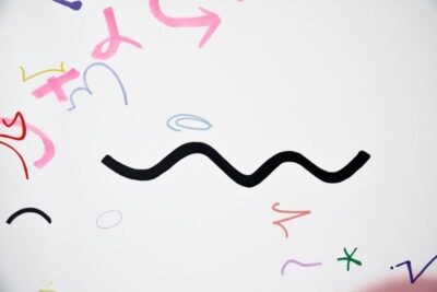 Black and pink lines and forms on the painting Very Important made by the artist Patricia Sandonis