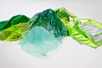 Patricia Sandonis photography showing a mountain landscape made with green plastic remnants