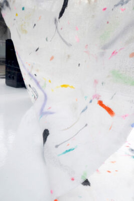 Detail of the colors of a painting on a white surface by artist Patricia Sandonis