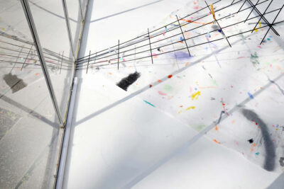 Fragments of colors and black lines on a white surface, detail of the art installation A Partition of the Sensible by Patricia Sandonis