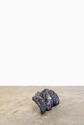 Small format painted ceramic sculpture on the floor of the gallery ángels Barcelona by artist Patricia Sandonis