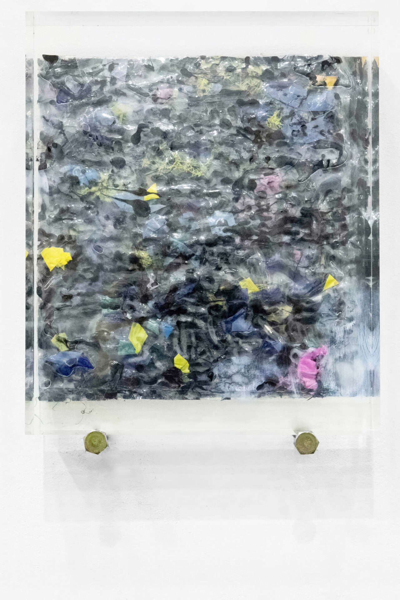 Square plastic sculpture on a wall by artist Patricia Sandonis