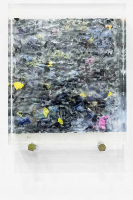 Square plastic sculpture on a wall by artist Patricia Sandonis