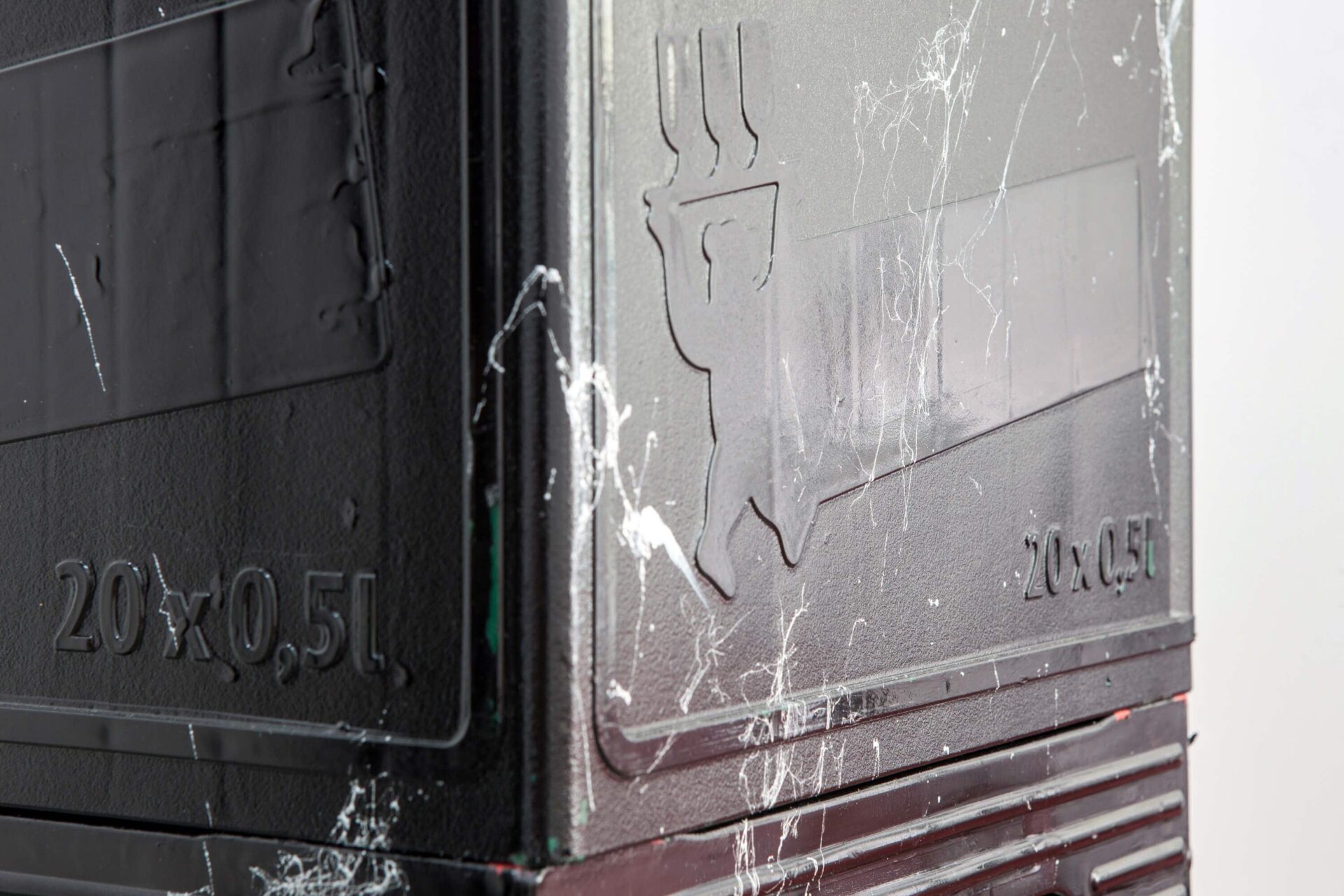 Detail from the black marbleized beer crates forming a column by artist Patricia Sandonis