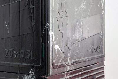 Detail from the black marbleized beer crates forming a column by artist Patricia Sandonis