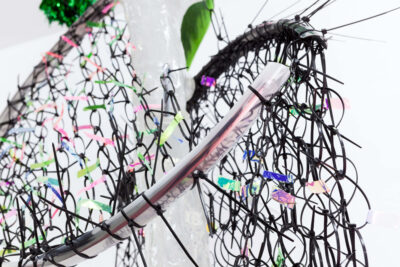 Net made out of black cable ties and resin, a detail from the sculpture artwork titled Das Kiez Monument by artist Patricia Sandonis