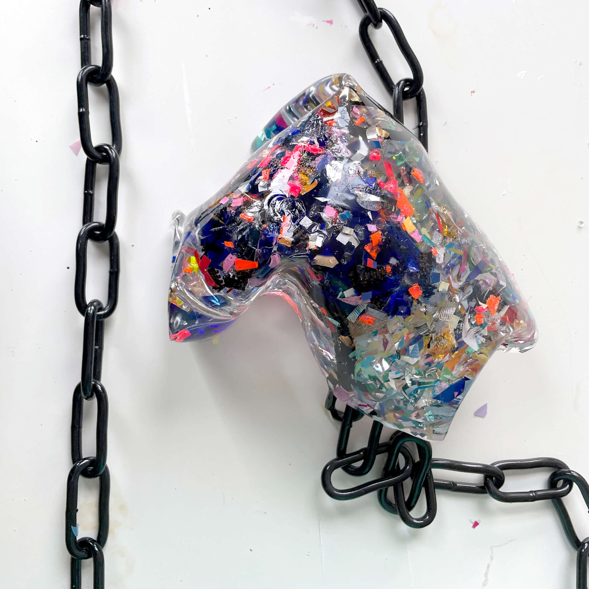 Patricia Sandonis sculpture artwork made with plastic, crystal-clear polyurethane, glass and chains