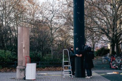 Artist Patricia Sandonis setting up a column sculpture called Ignored in Public in Berlin. Art in the public realm