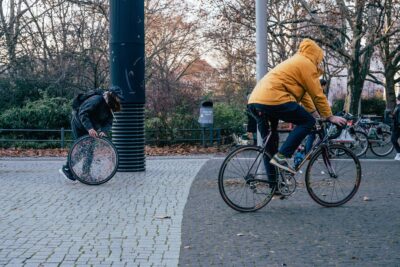Performance by artist Patricia Sandonis where she rolls a crystal-clear sculpture on the streets of Berlin