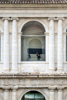 Performance by artist Patricia Sandonis at Museo Patio Herreriano carrying a sculpture in procession