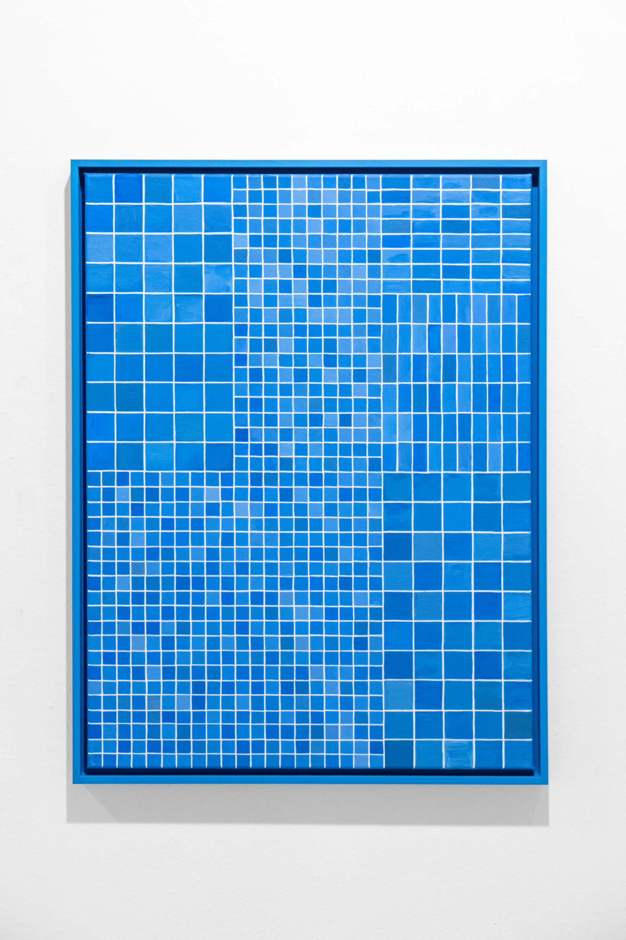 Blue oil painting on blue frame by conceptual artist Patricia Sandonis showing small shapes imitating the tiles from the facade of the Palace of Tears in Berlin