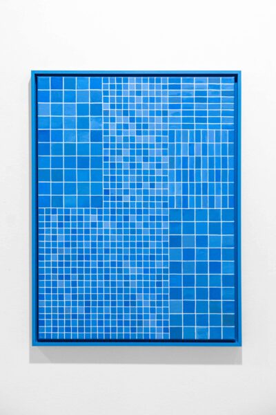 Blue oil painting on blue frame by conceptual artist Patricia Sandonis showing small shapes imitating the tiles from the facade of the Palace of Tears in Berlin