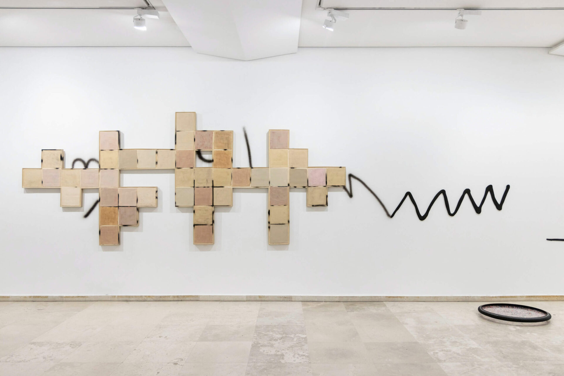 Contemporary art installation by the artist Patricia Sandonis, showing ceramic tiles, graffiti and sculptures at the exhibition Uncertainty in Consensus in Museo Patio Herreriano in Valladolid