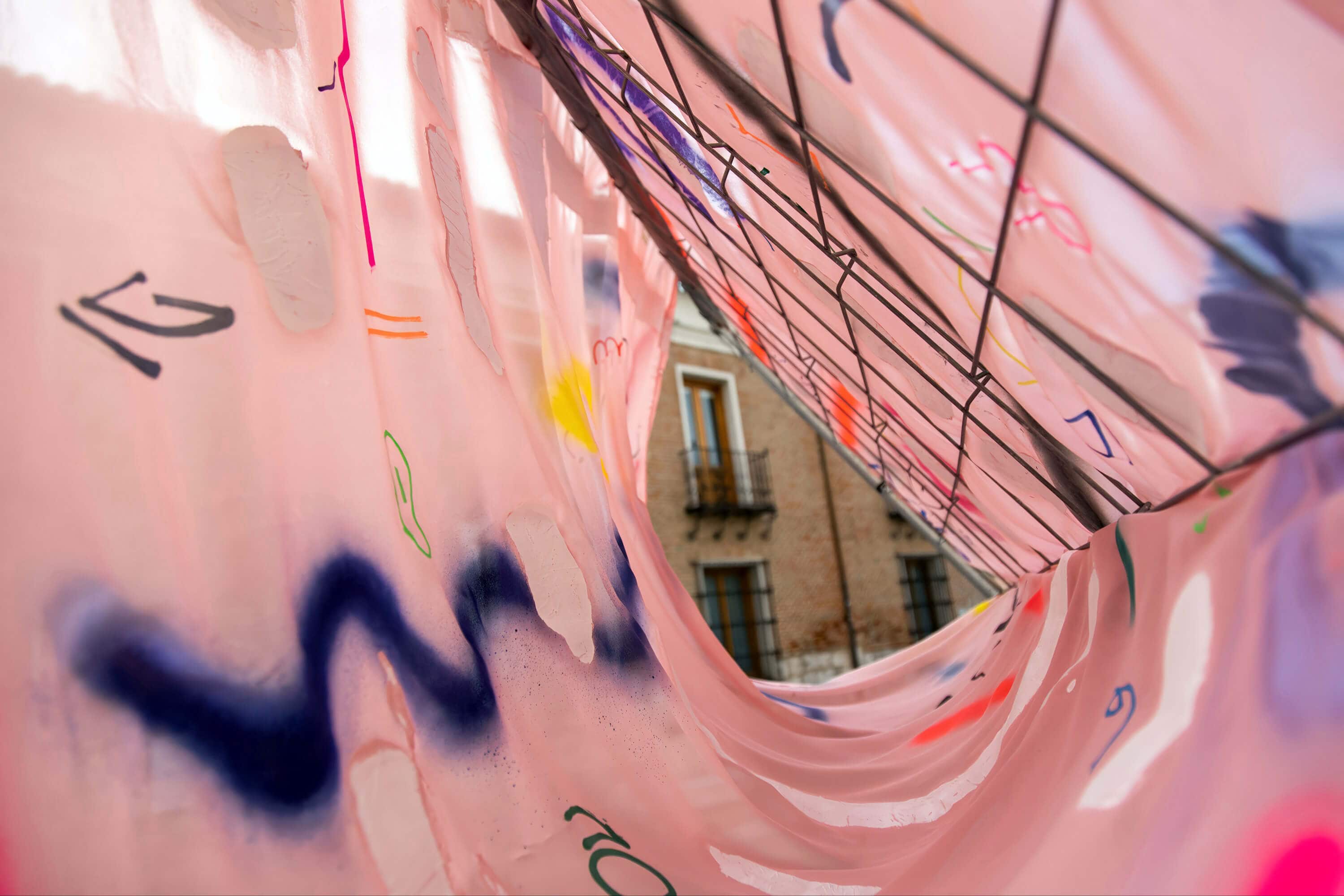 Detail from the pink painting art installation by artist Patricia Sandonis