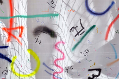 Different colors, forms and lines painting on a white surface by artist Patricia Sandonis