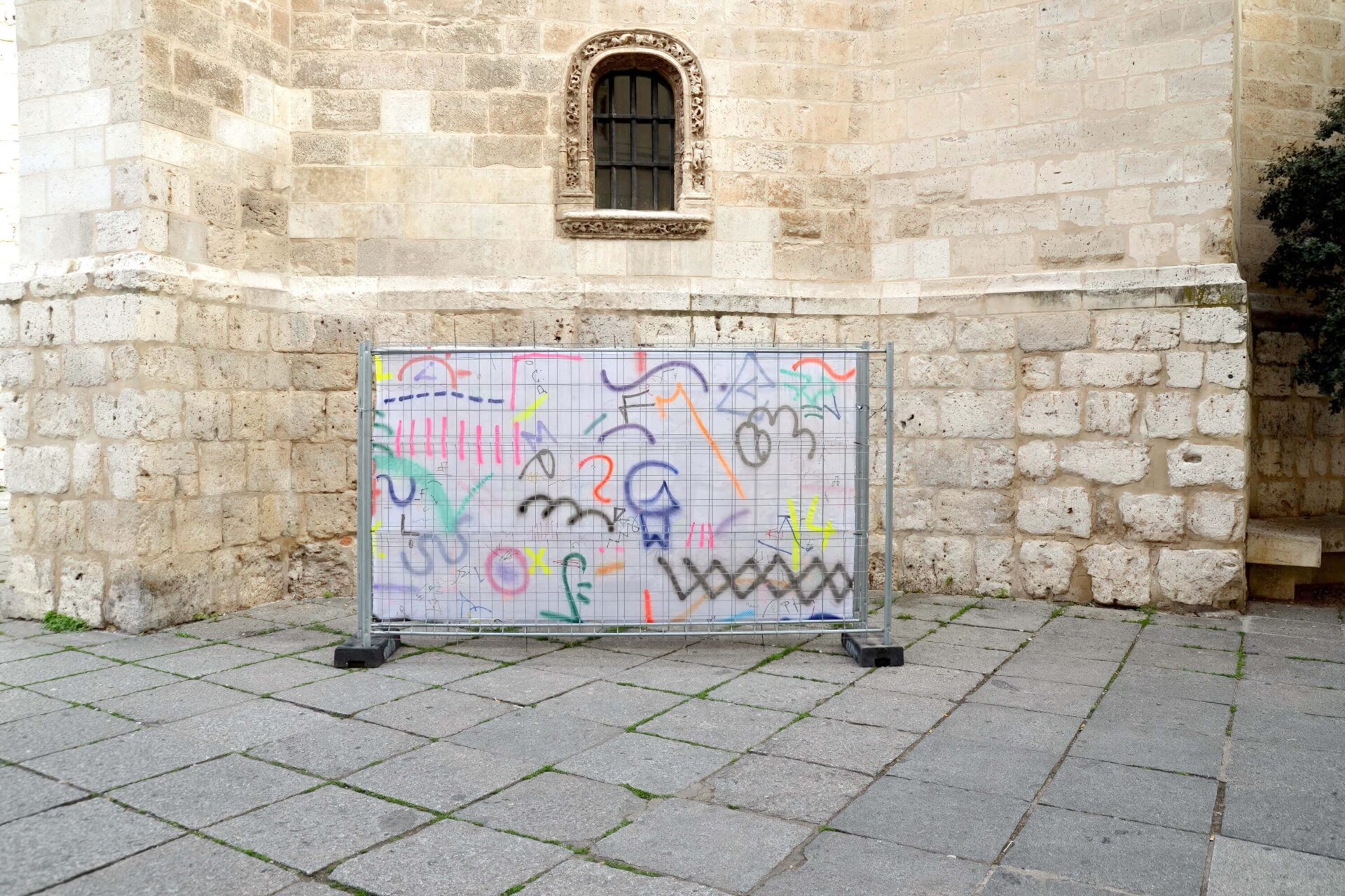 Painting on fence in a street of Valladolid by artist Patricia Sandonis