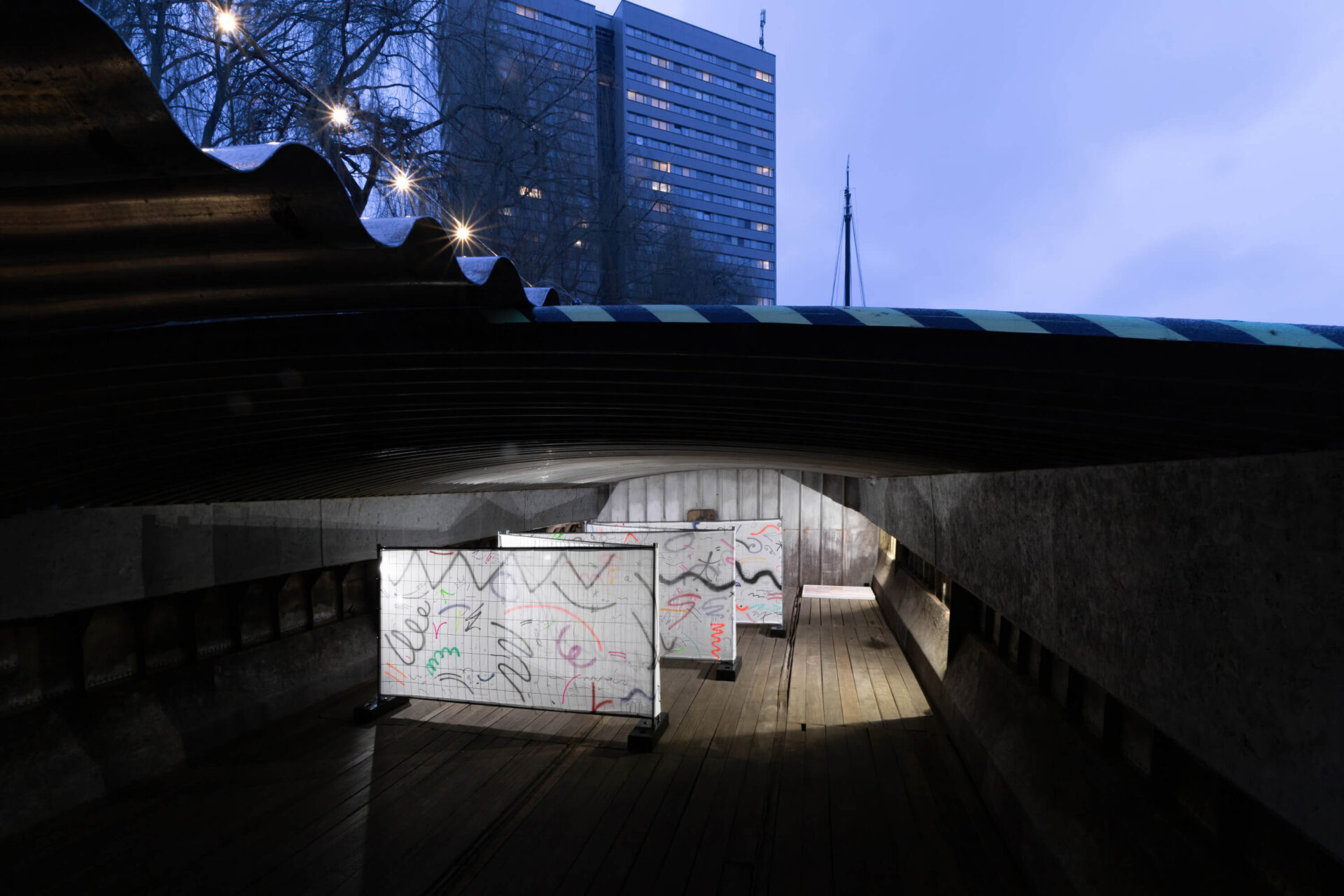 Contemporary art installation by artist Patricia Sandonis using a big-scale painting on fences at Hošek Contemporary Gallery in Berlin