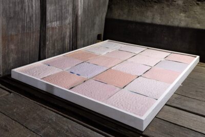 Sculptural art installation of pink glazed ceramic tiles by artist Patricia Sandonis called The In Between