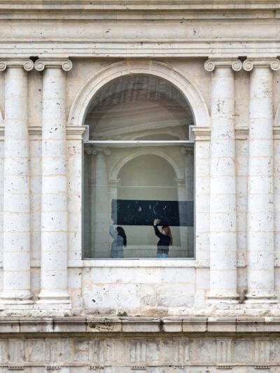 Performance by artist Patricia Sandonis at Museo Patio Herreriano carrying a sculpture in procession