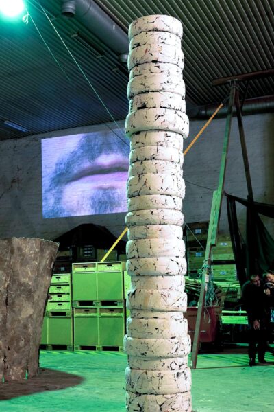 Patricia Sandonis art installation titled Photo Until it Becomes Marble, showing a big-format white column made out of car tires